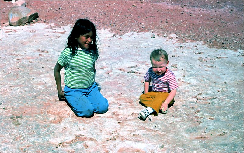 Eric and Navajo girl next to dinosaur track
